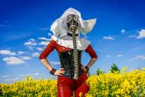 The Red Nun - Gasmasked into a canola field