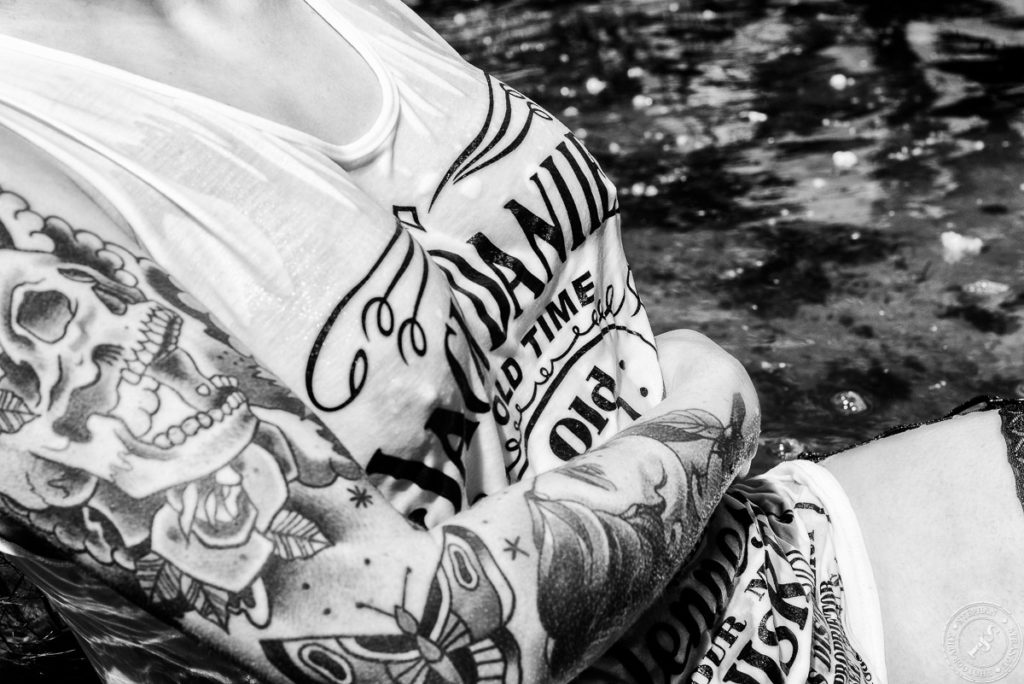 Busty girl with a wet Jack Daniels shirt