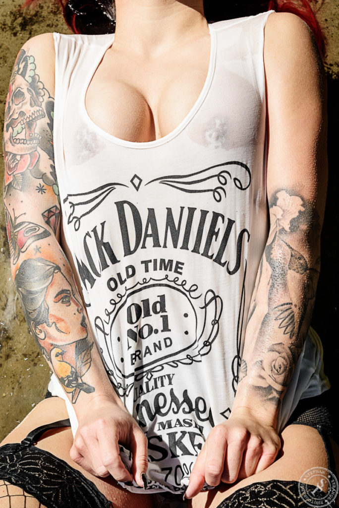 Busty girl with a wet Jack Daniels shirt