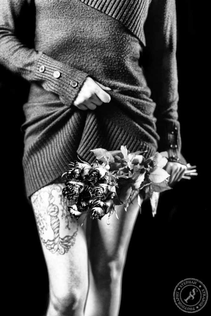 Nude Roses. Sexy inked alternative girl covering her pussy with red roses