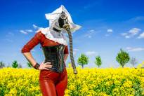 The Red Nun - Gasmasked into a canola field