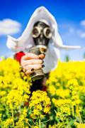 The Red Nun - Gasmasked into a canola field