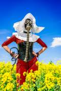 The Red Nun - Gasmasked into a canola field