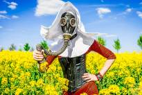 The Red Nun - Gasmasked into a canola field